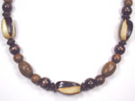 dark and medium brown wood necklace with burnt wood barrel