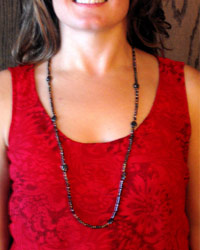 black millefiori necklace on red print