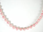 pink and white pearl necklace