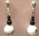 white and black earrings